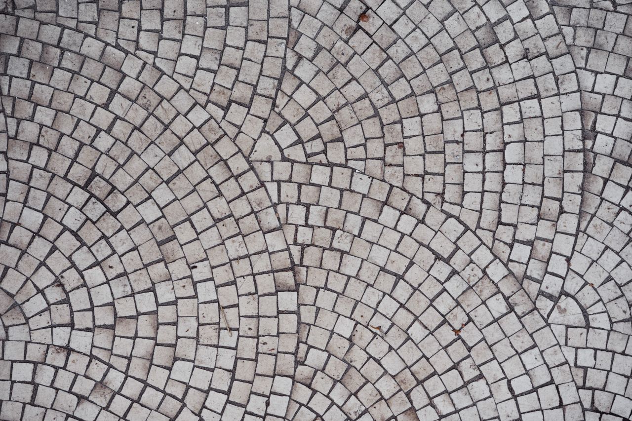 Crafting Captivating Headlines: Your awesome post title goes here Top view of aged ceramic square shaped tile placed in rows and lines of circle